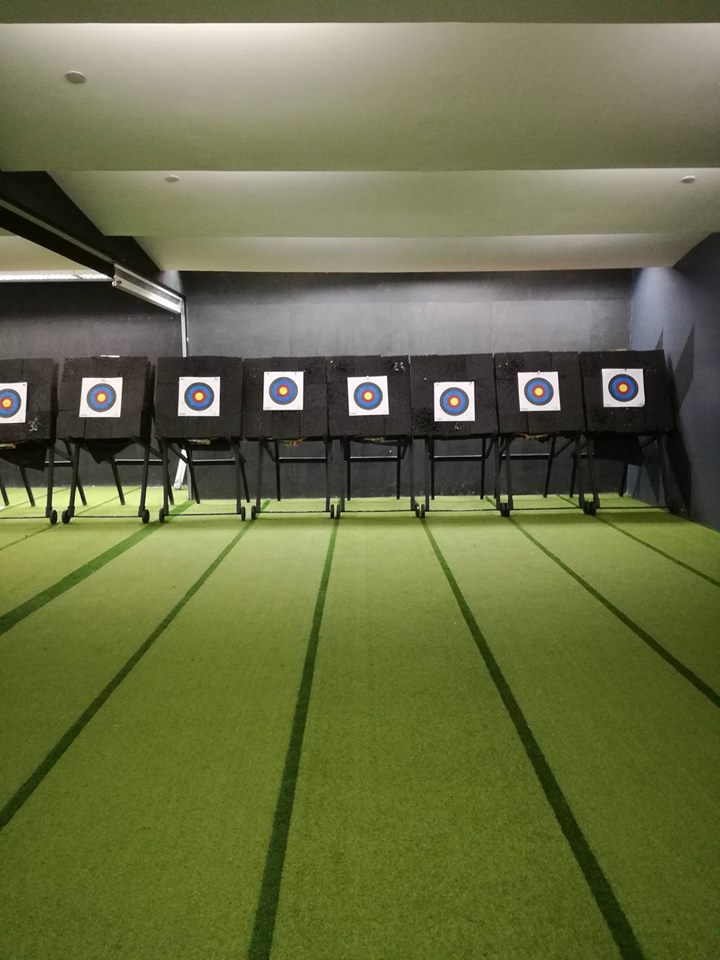 Row of archery targets with colorful bullseye faces at Arrowland range
